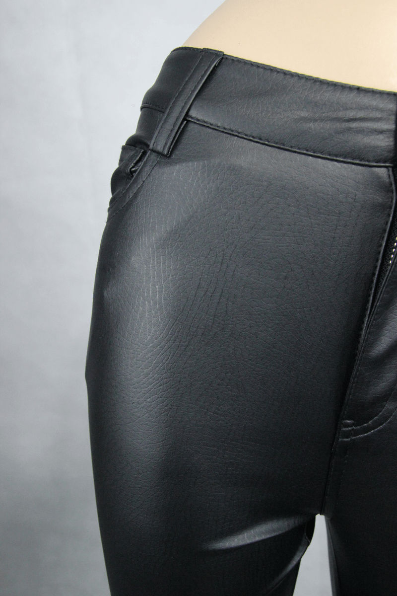 Close-up of sexy women's tight black PU leather pants, showcasing sleek fit and stylish design details.
