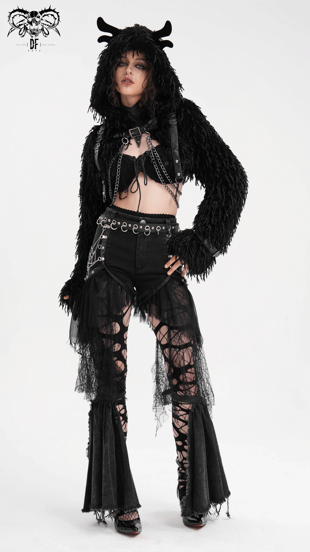 Model showcasing a gothic black faux fur cape with horns, paired with edgy lace and metal accents for a bold look.