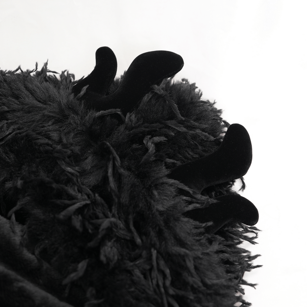 Close-up of the shaggy black faux fur with horn accents, showcasing a striking gothic design. Perfect for bold fashion statements.