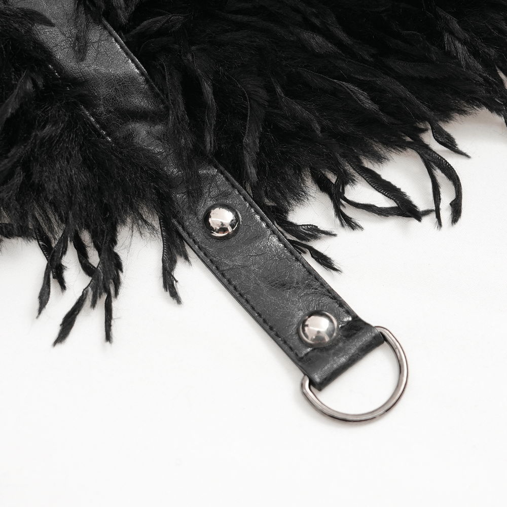 Close-up of black faux fur cape strap with metal accents and chains, showcasing gothic style and rugged texture.