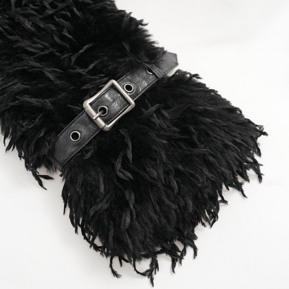 Close-up of shaggy black faux fur cape with leather buckle detailing, perfect for a gothic look.