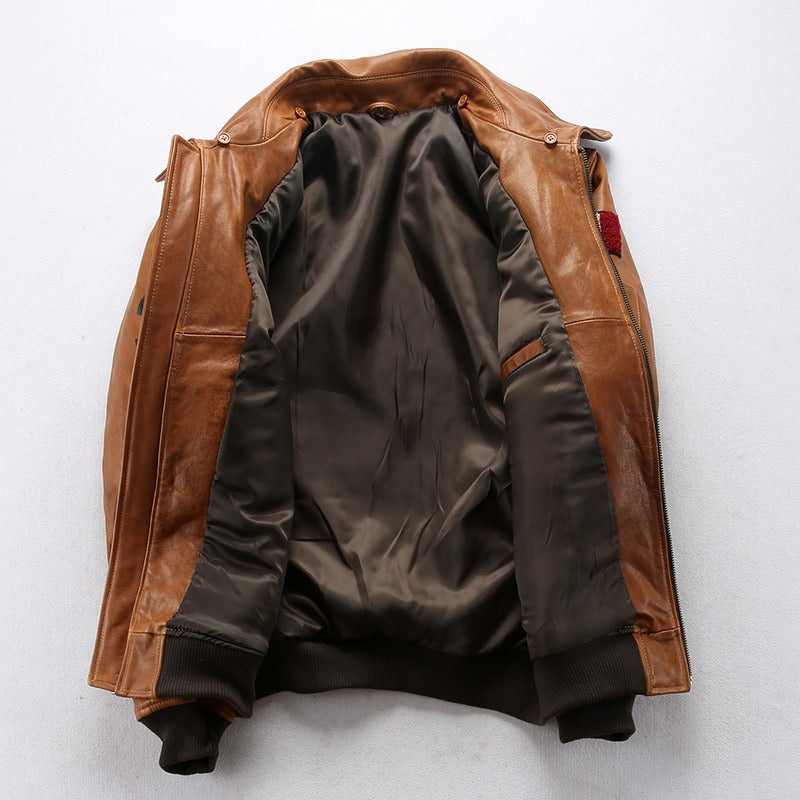 Interior view of a vintage lambskin men's bomber jacket with fur collar in camel color.