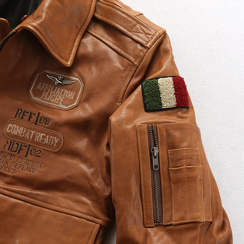 Vintage lambskin men's bomber jacket in camel with military patches and fur collar.