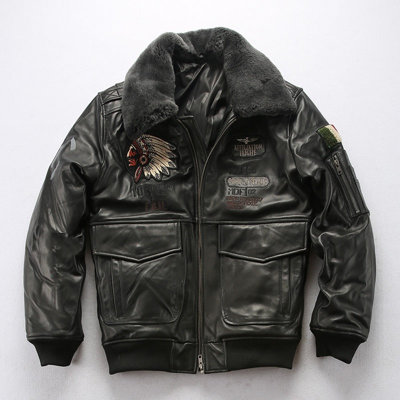 Men's bomber jacket in black leather with fur collar and vintage military embroidery details.