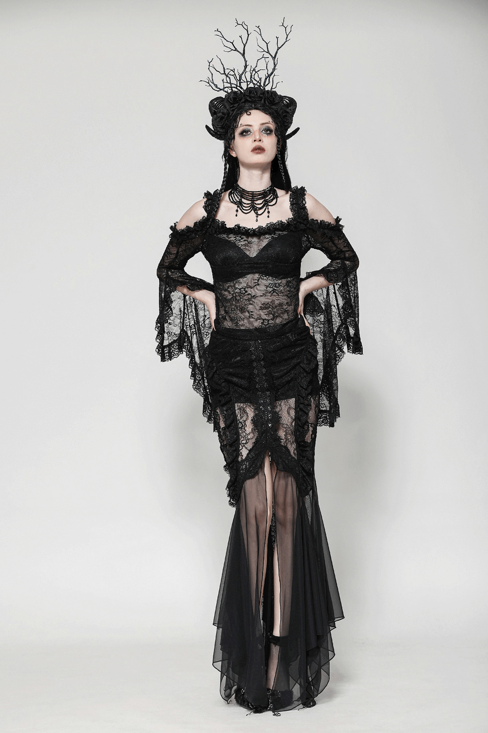 Gothic sheer black lace top with flowing bell sleeves and dark romantic elegance.