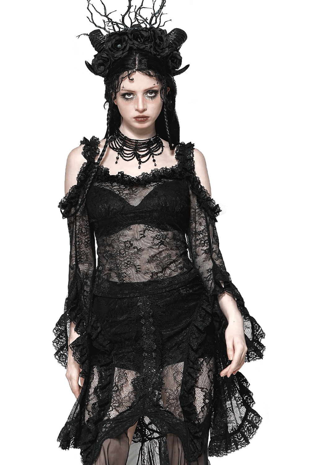 Gothic sheer black lace top with dramatic bell sleeves, paired with elegant accessories and hairstyle.
