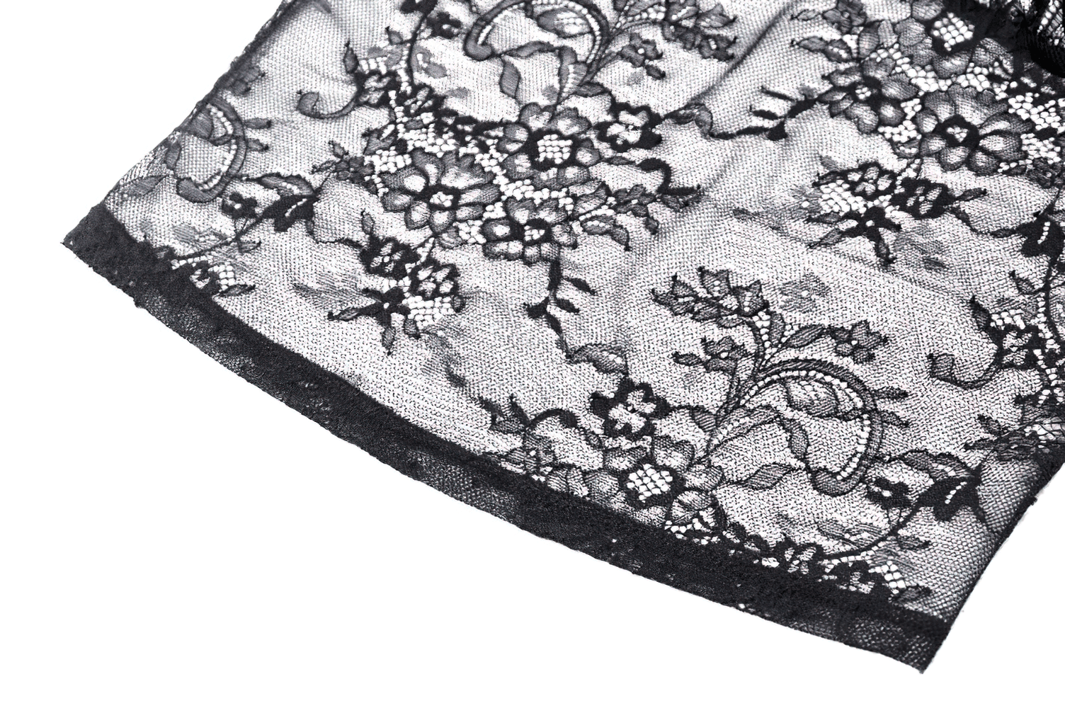 Close-up of sheer black lace fabric with floral patterns, perfect for gothic and romantic styles.