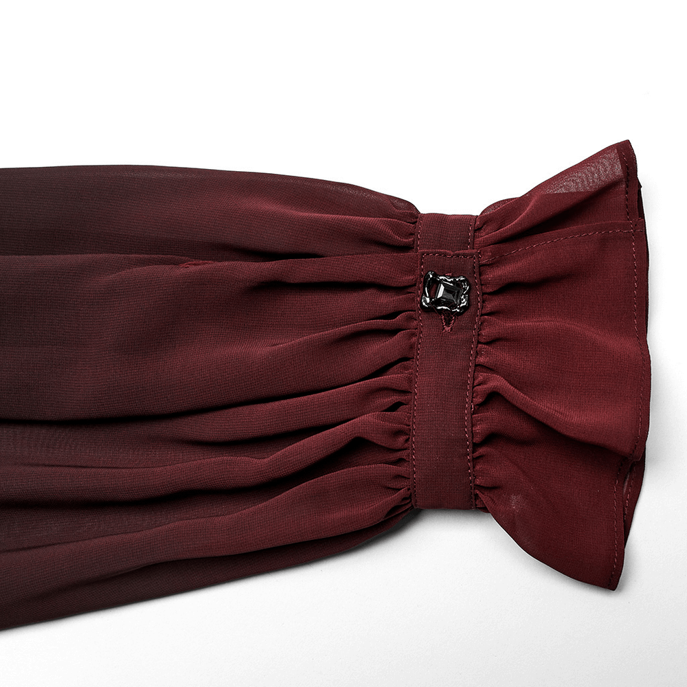 Detail of sheer chiffon sleeve with a ruffled cuff and decorative metal clasp for gothic men's shirt.