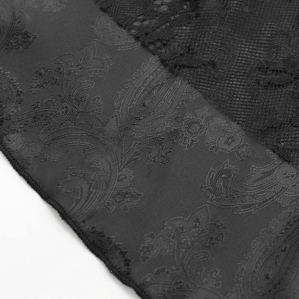 Close-up of sheer black lace fabric featuring intricate floral patterns, perfect for an elegant gothic dress.