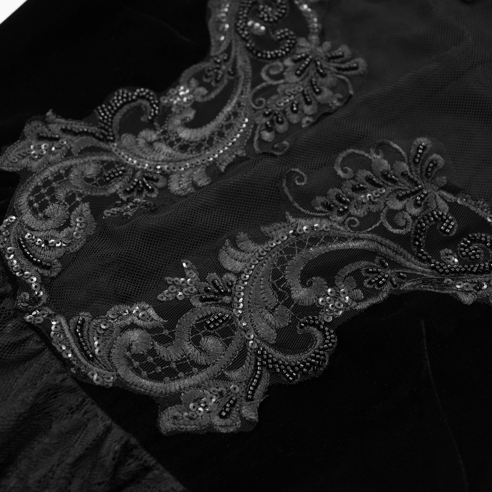 Close-up of intricate black lace with beaded appliques on a sheer mesh fabric, perfect for gothic fashion.