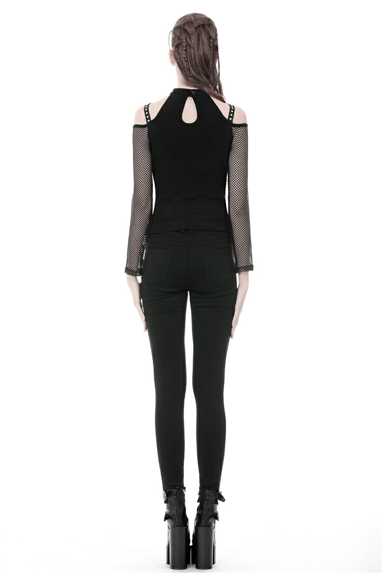 Back view of a model wearing a black sheer mesh long sleeved top with lace-up detailing and fitted pants.