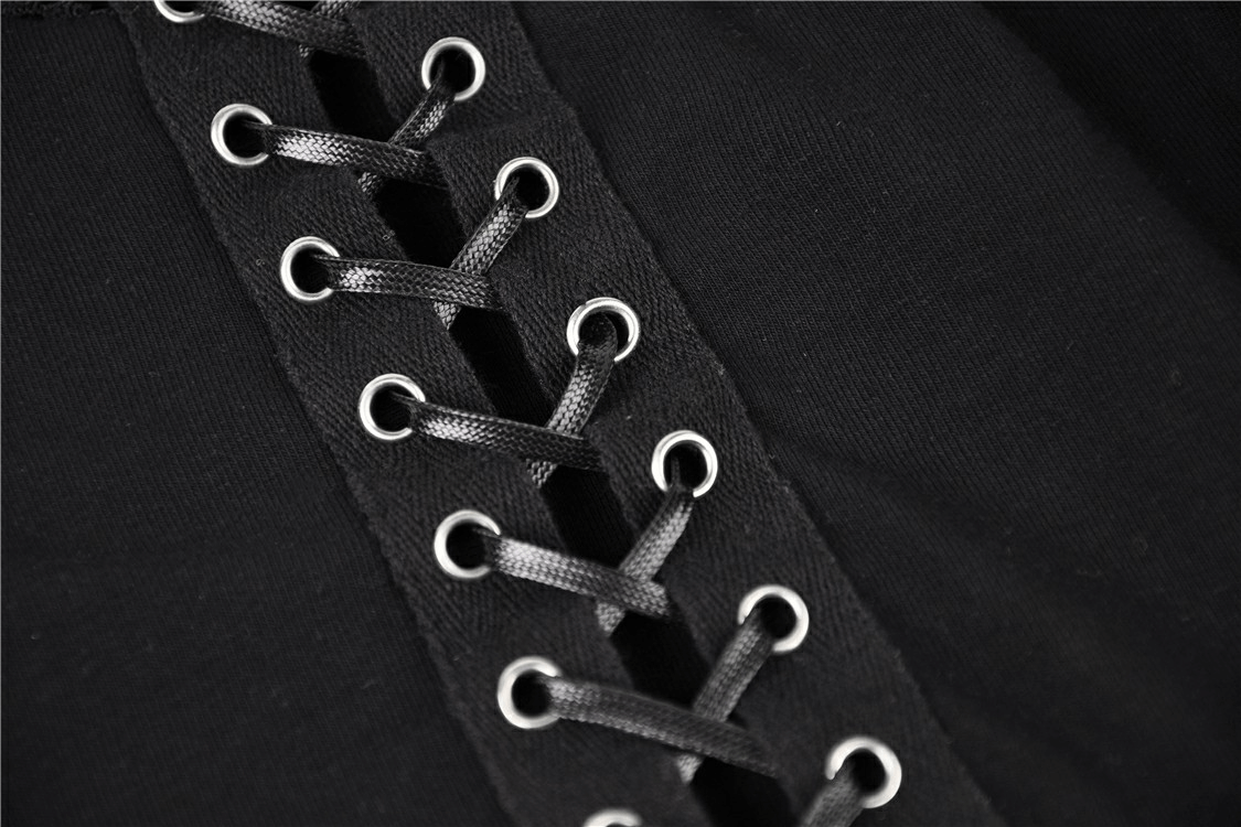 Close-up of black lace-up front detail on sheer mesh top, showcasing edgy style and playful design.