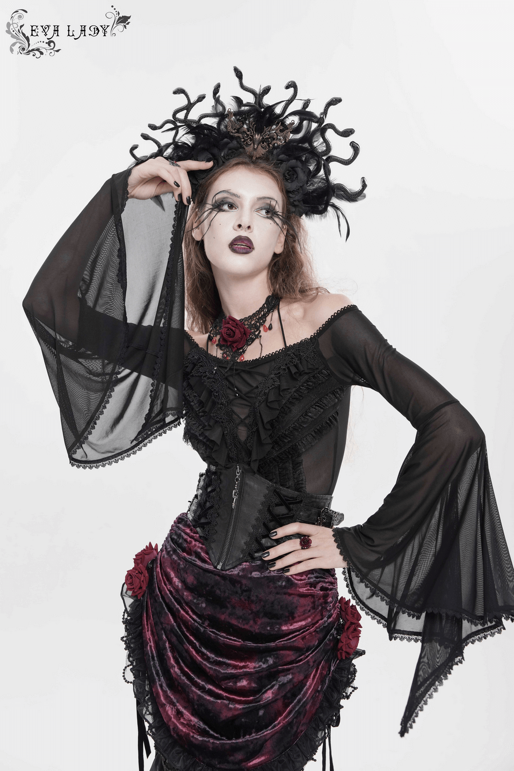 Sheer Off-Shoulder Ruffled Mesh Top with Bell Sleeves worn by a model with gothic hairstyle and striking accessories.