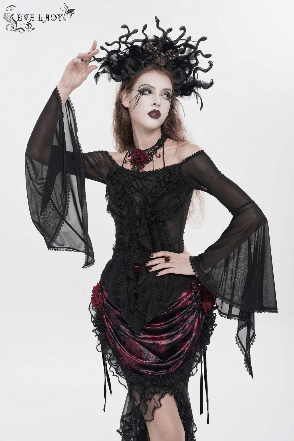 Sheer Off-Shoulder Ruffled Mesh Top with Bell Sleeves modeled with gothic flair and dramatic accessories.