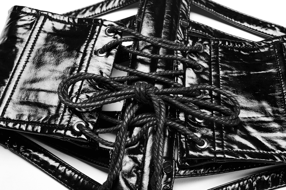 Shiny patent PU punk corset belt with steel buckle and lace-up design for an edgy, stylish look.