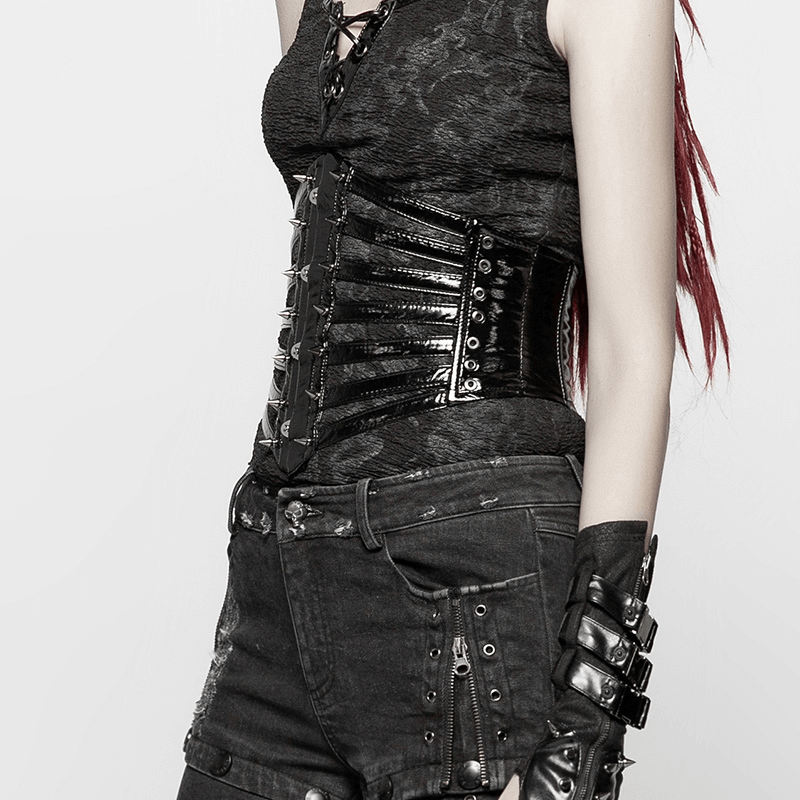 Punk corset belt in shiny black PU with steel buckle, metal cones, and edgy design accentuating the waist.