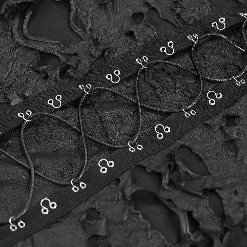 Close-up of shredded black fabric with lace-up design and metal accents for gothic alternative hoodie.