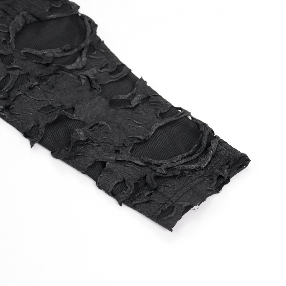 Close-up of shredded black fabric showcasing distressed details from a gothic hoodie for alternative fashion.