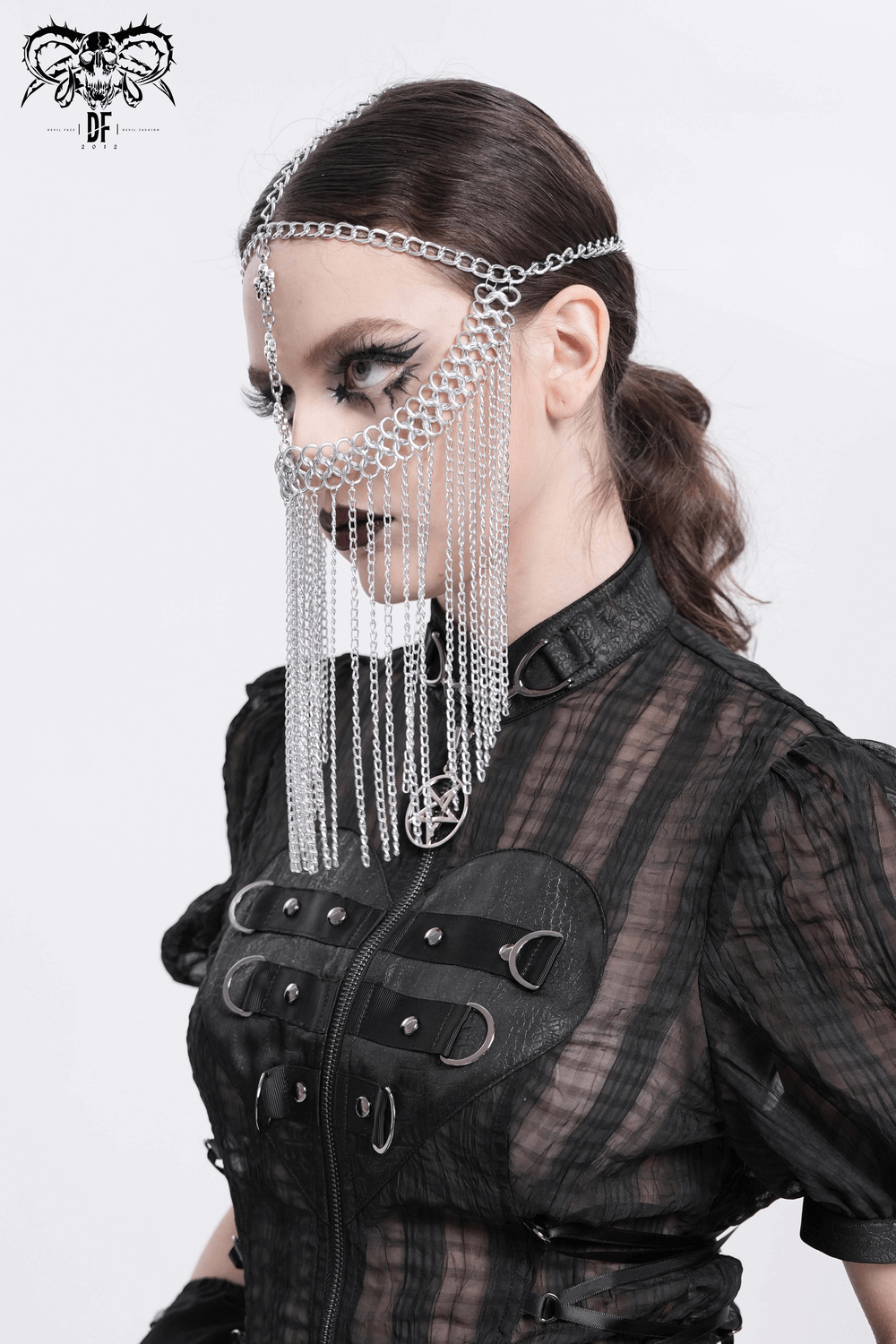 Silver chain headpiece with drape fringe and cross charms, ideal for gothic or punk outfits.