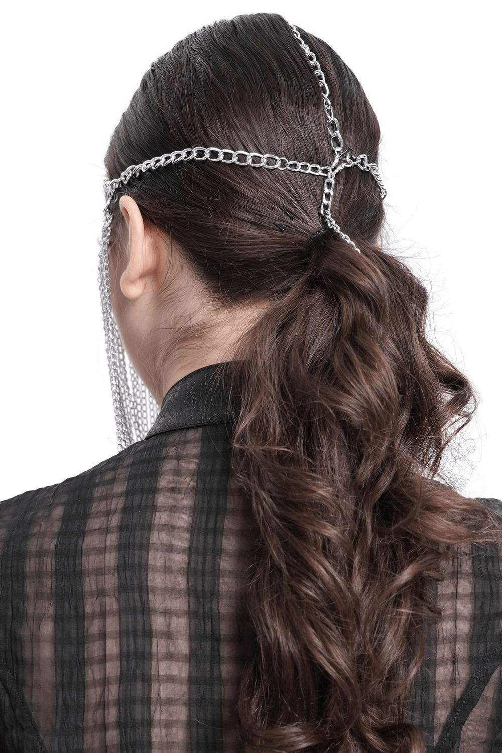 Back view of a woman wearing a silver chain headpiece with fringe veil, enhancing her gothic fashion style.