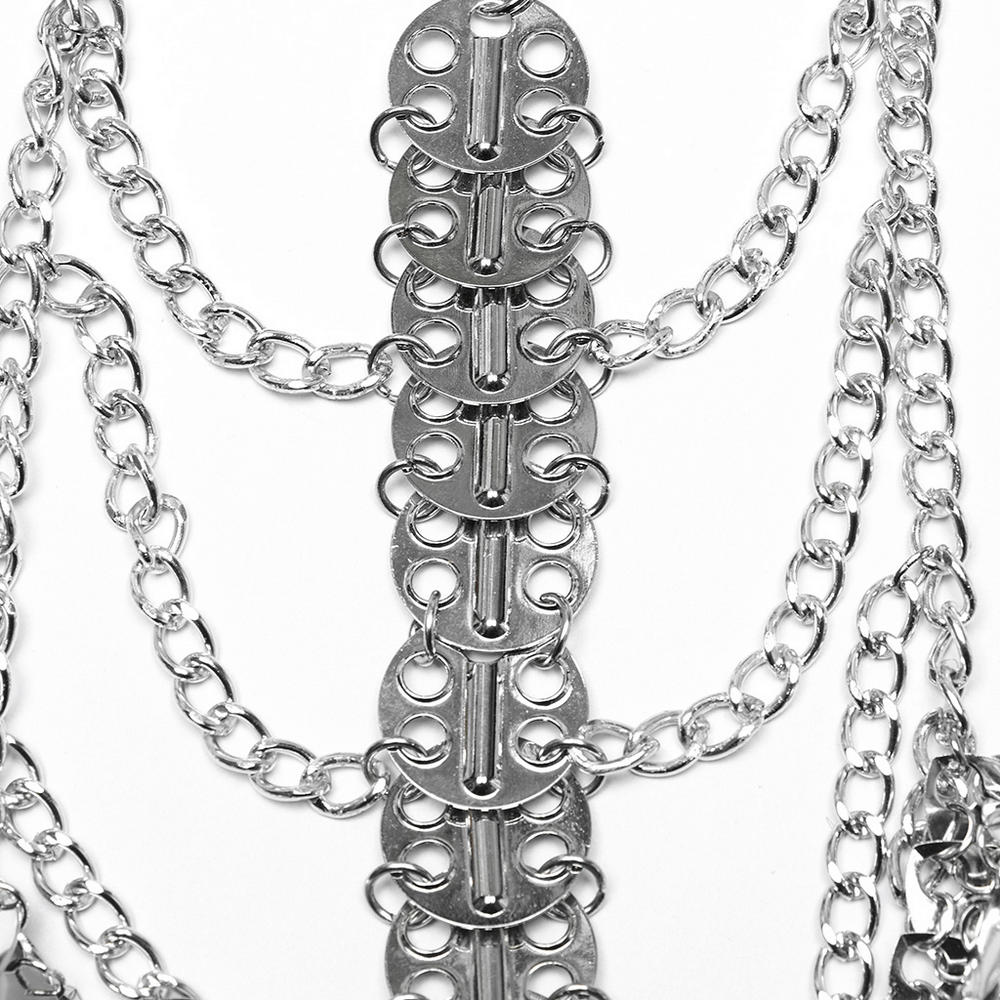 Close-up of a silver dragon scale chain bra harness with layered chains and metal accents for bold style.