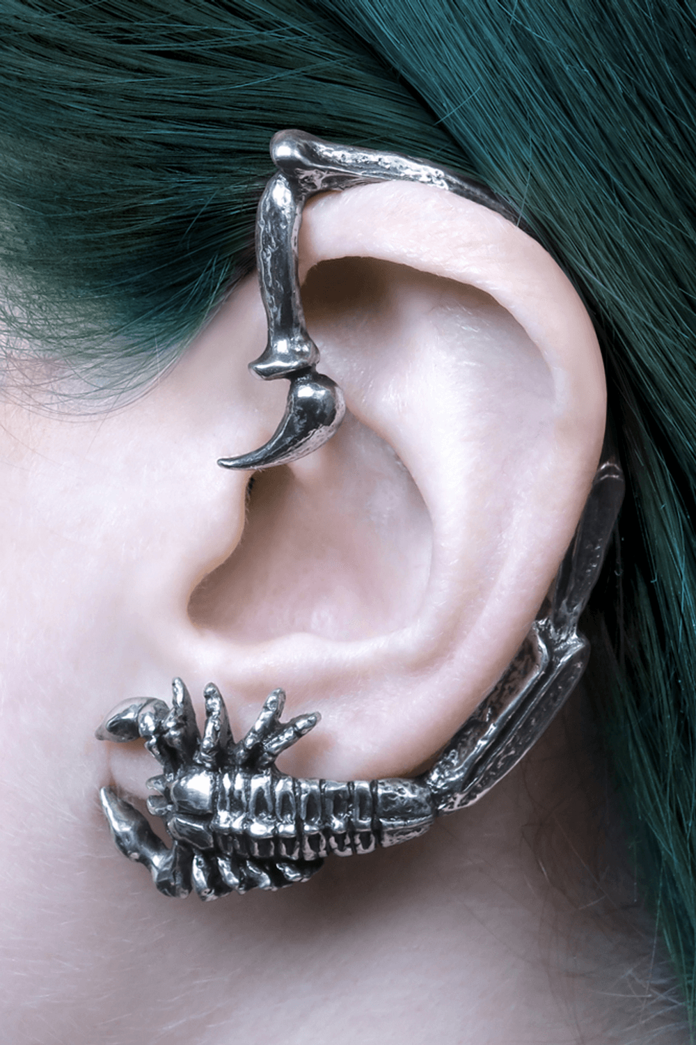 Silver Gothic Scorpion Earwrap with Detailed Claw Design showcasing intricate details around an ear.