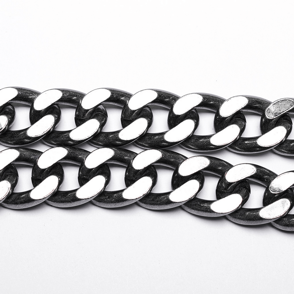 Close-up of heavy-duty silver-linked punk chain, featuring oversized links and an antique silver finish.