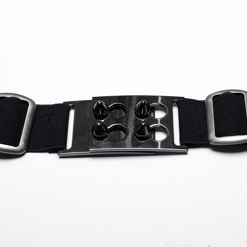 Close-up of a black punk belt with metallic spikes and secure buckles, showcasing edgy fashion style.