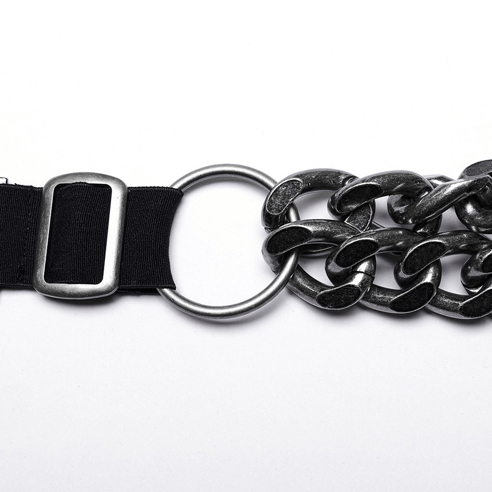 Close-up of silver-linked punk chain harness with adjustable buckle and elastic straps for a bold look.