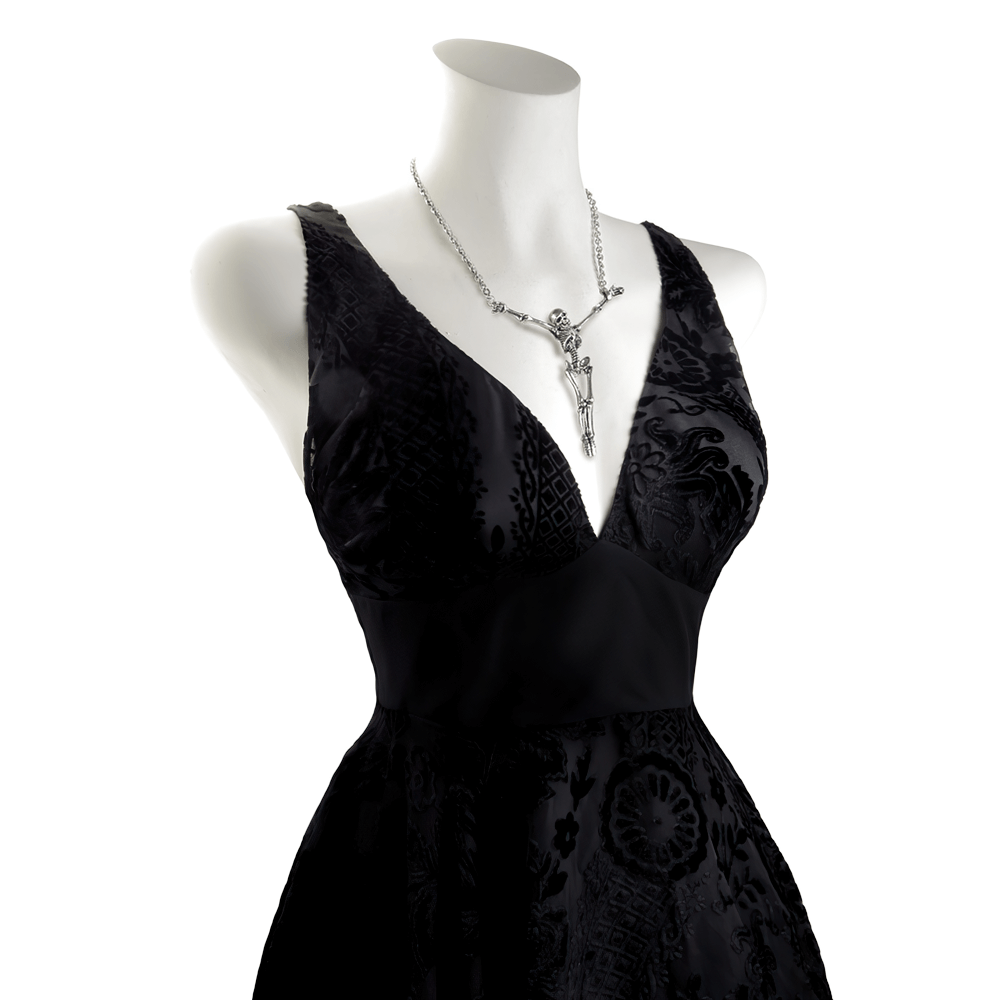 Stylish black dress showcasing a Skeleton Cross Pendant Necklace with pewter chain for a gothic touch.