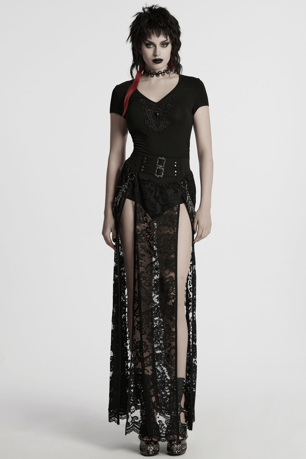 Edgy gothic look featuring lace skirt and black V-neck top with skull motif, perfect for a bold, stylish statement.