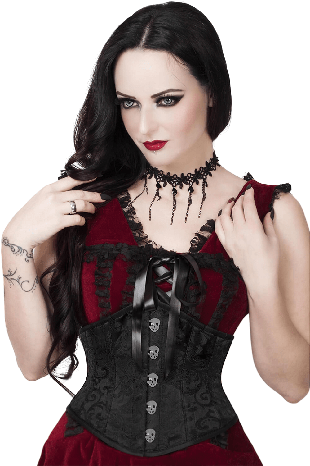 Model wearing a skull busk brocade underbust corset with a dark velvet dress and gothic accessories.