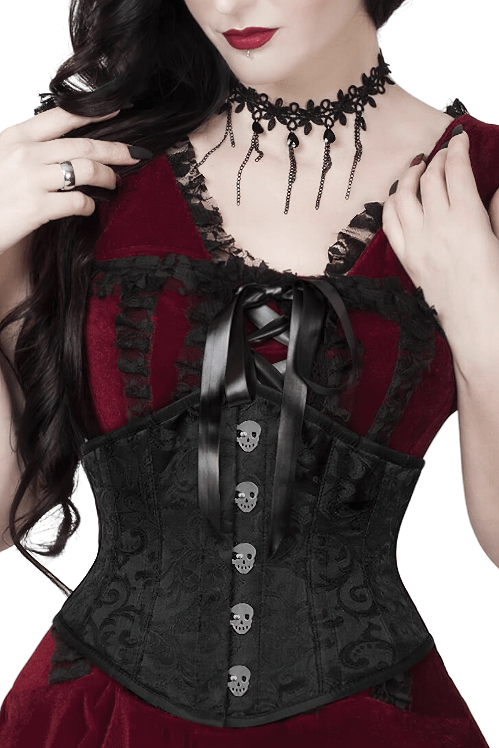 Bold black skull brocade underbust corset with ribbon lacing, styled with a gothic choker and a red dress.