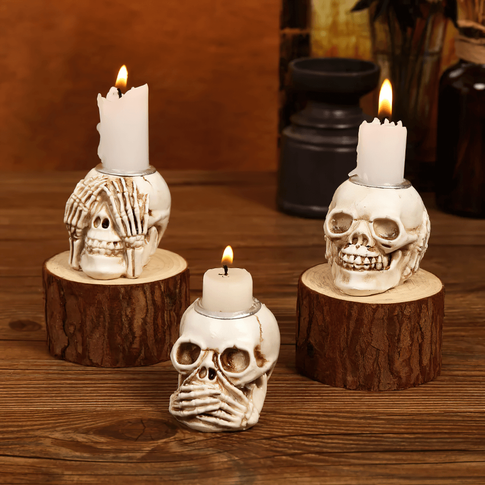 Set of skeleton-themed candle holders with spooky skull designs, perfect for Halloween and gothic decor.