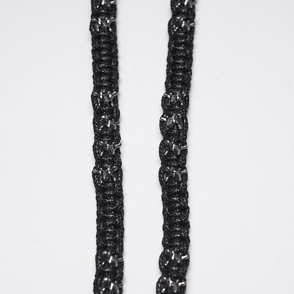 Skull Chain Harness Necklace with Layered Metal Design featuring intricately woven black chains.