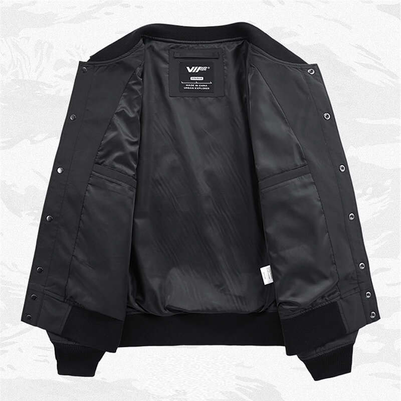 Interior view of a black skull embroidery bomber jacket for men, showcasing sleek lining and convenient pockets.