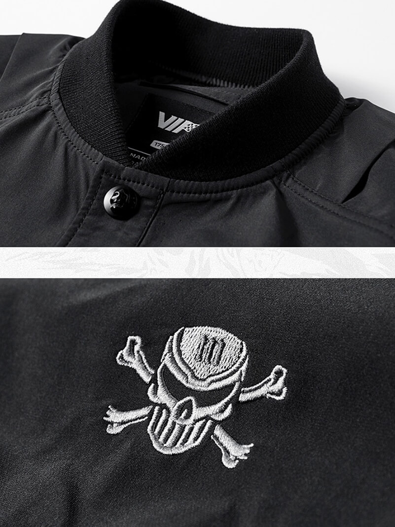 Black bomber jacket featuring skull embroidery and a stylish collar, perfect for a trendy military-inspired look.