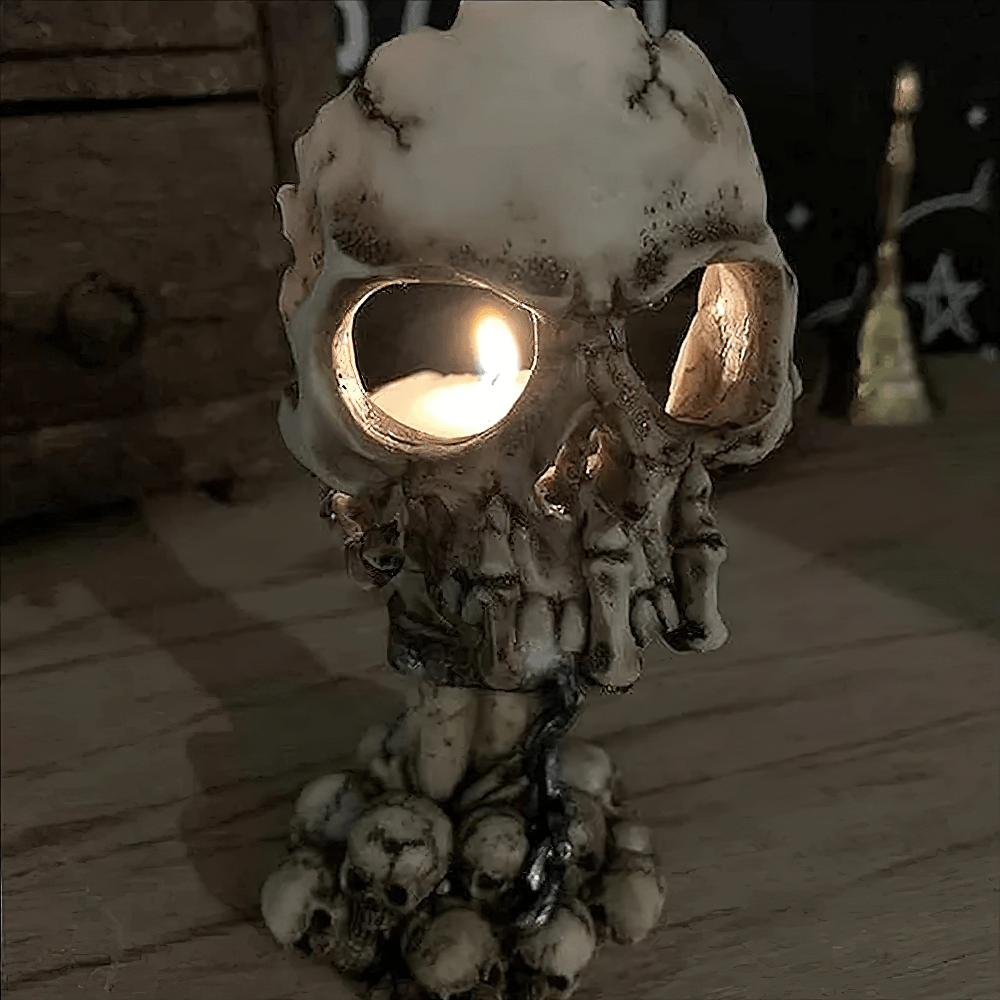 Skull Hand Tealight Holder for Gothic Halloween Decor with eerie candle glow and spooky bone details.