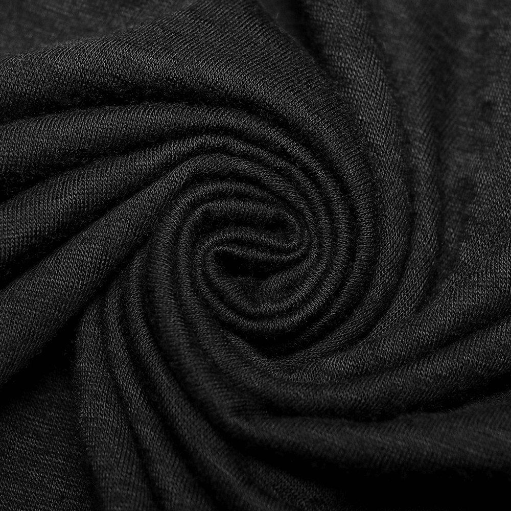 Close-up of black fabric swirling in a spiral, showcasing the soft texture for a stylish punk top.