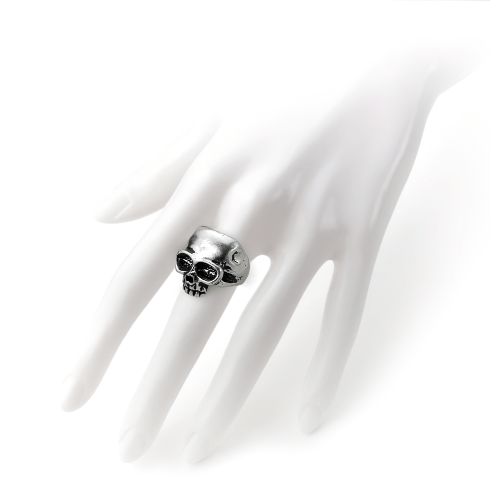 Bold skull ring on a hand, showcasing punk jewelry style and rebellion in fine English pewter.