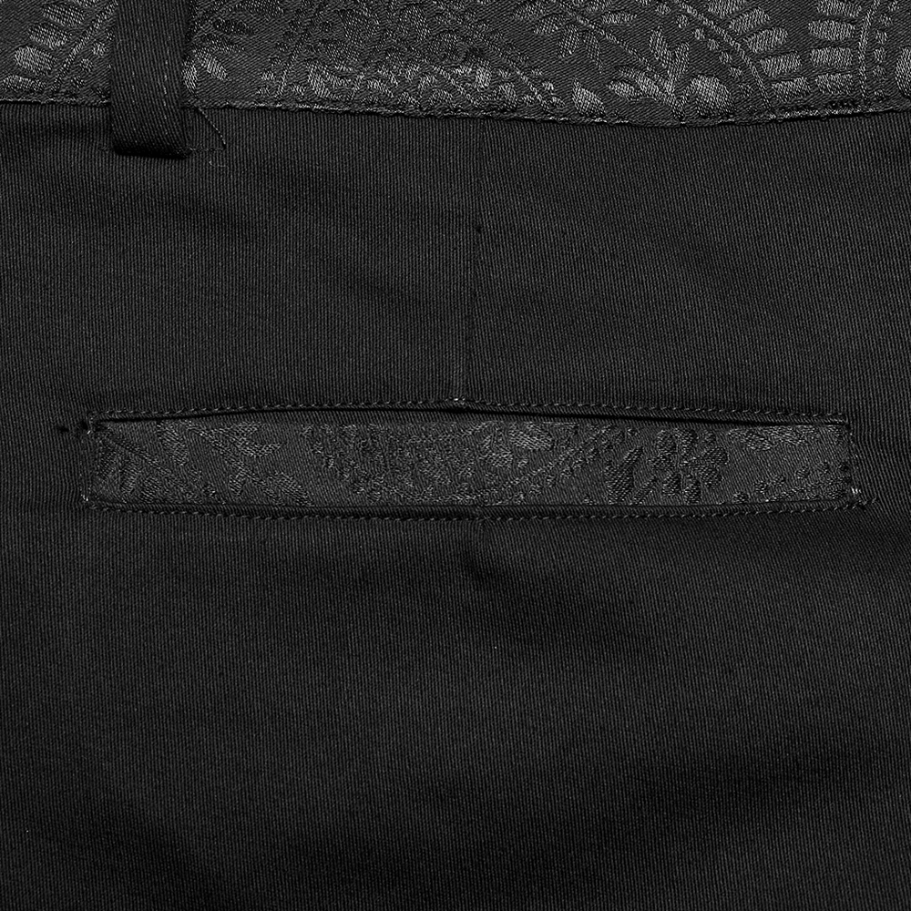 Close-up of the sleek black gothic trousers pocket with webbing detail and lace trim, showcasing stylish craftsmanship.