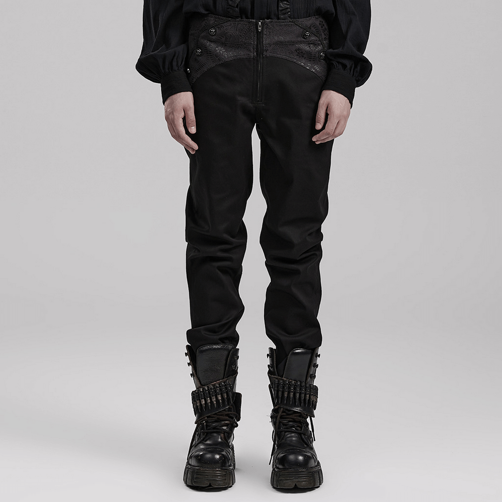 Sleek black gothic slim-fit trousers with webbing detail and side pockets, paired with rugged black boots.