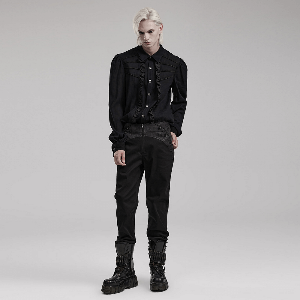 Model showcasing sleek black gothic slim-fit trousers with pockets and stylish buttoned shirt.