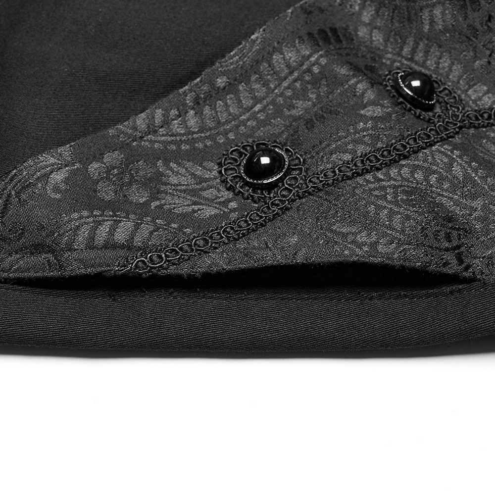 Close-up of gothic slim-fit trousers showcasing lace detail and handmade button embellishments.