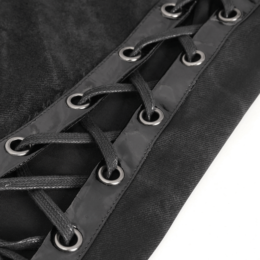 Close-up of stylish black maxi skirt showcasing unique side lacing details for a trendy look.