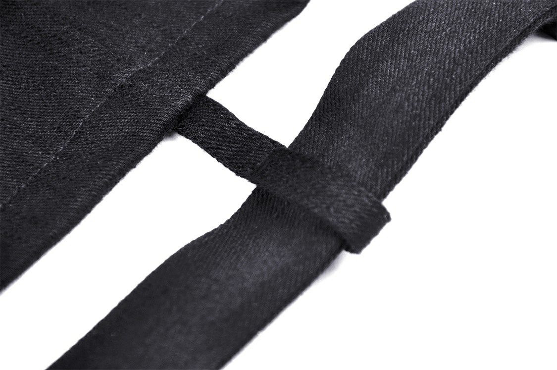 Close-up of sleek black fabric detailing with a belt accent, showcasing modern style and chic design.
