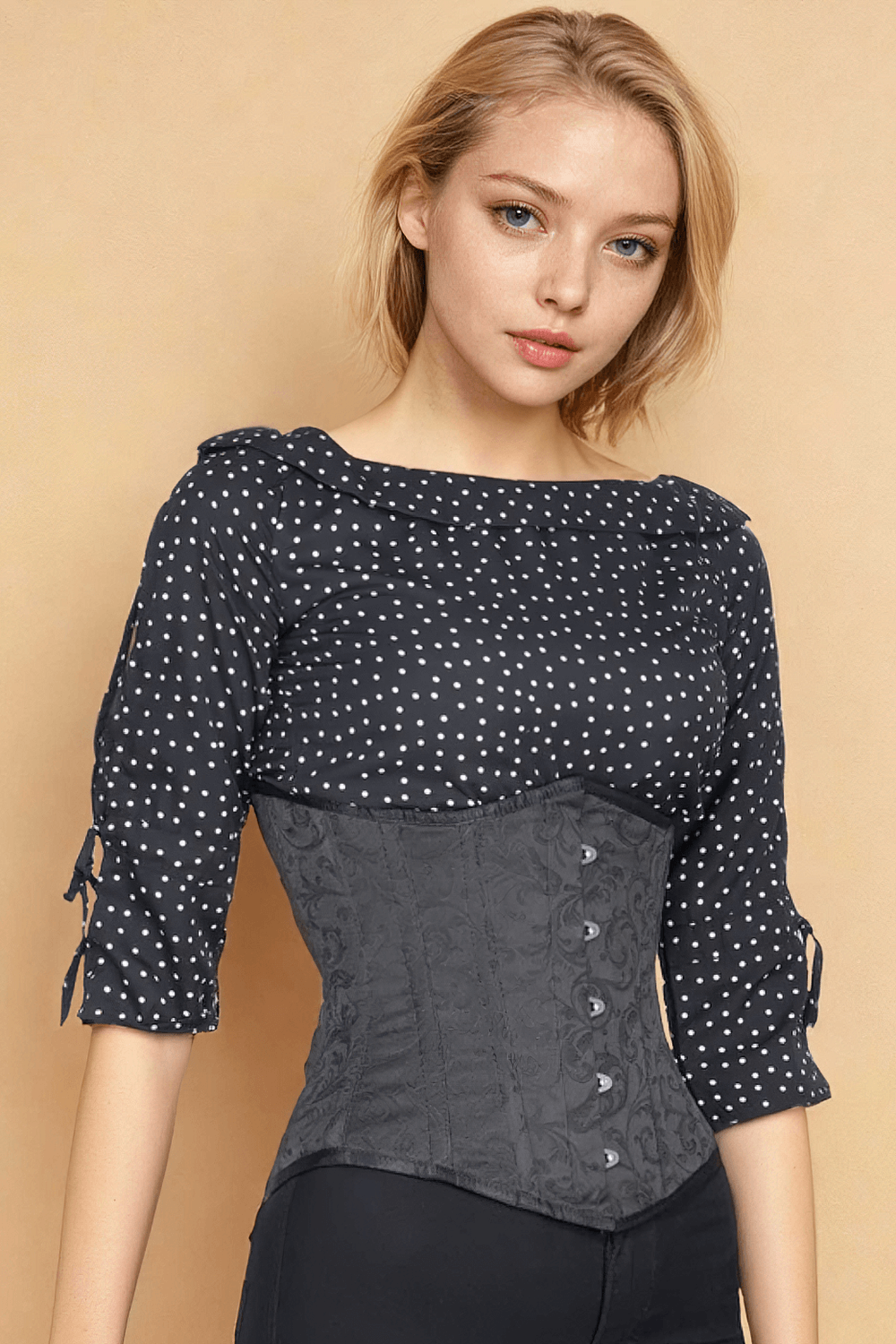 Sleek underbust brocade corset with steel boning, paired with a polka dot blouse, showcasing a stylish silhouette.