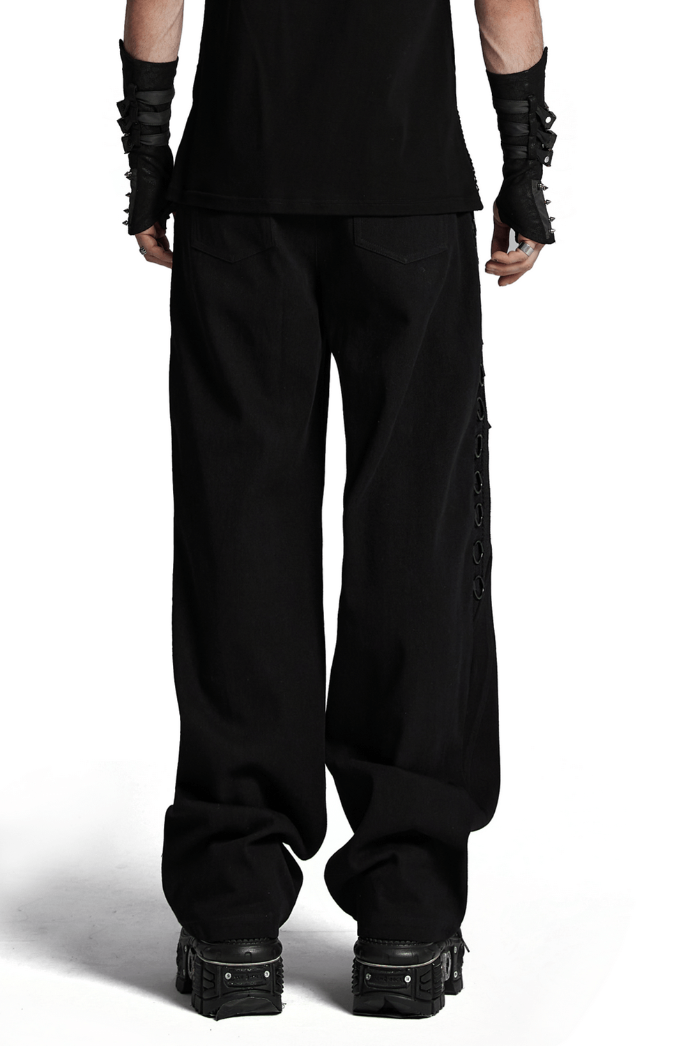 Back view of sleek Gothic black pants with metal loops, showcasing punk-style design and vertical striped mesh accents.