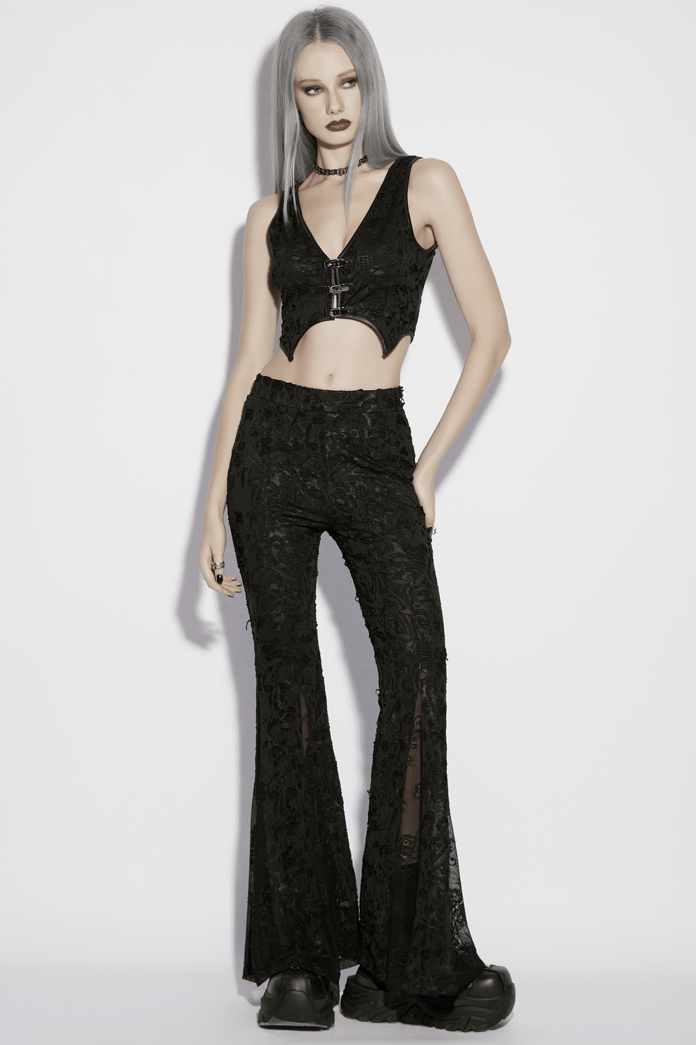 Alt Tag: Sleek Gothic Jacquard Lace High Waist Flared Pants on model, black embossed jacquard with sheer lace flare legs and high waist fit
