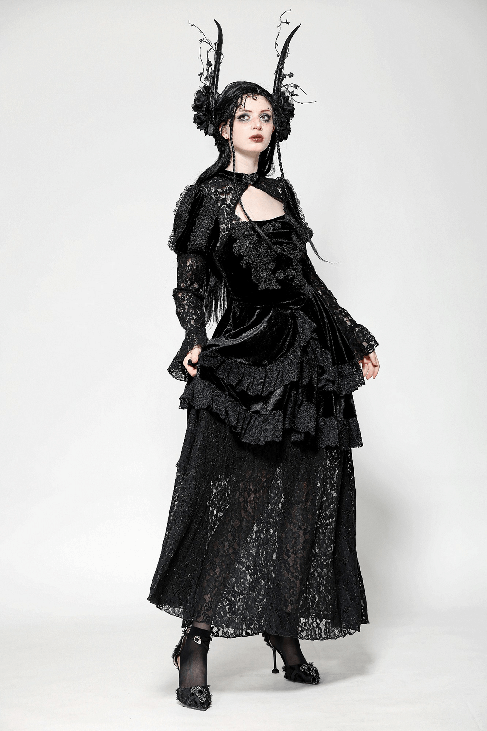 Sleek gothic lace tiered dress featuring velvet accents, perfect for a dramatic and elegant look.